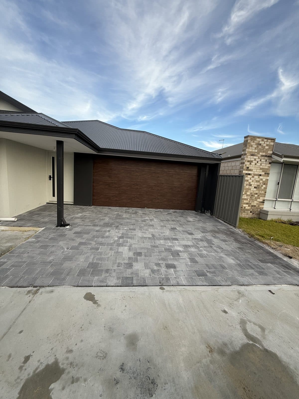 Grey concrete block paving laid across a Perth driveway